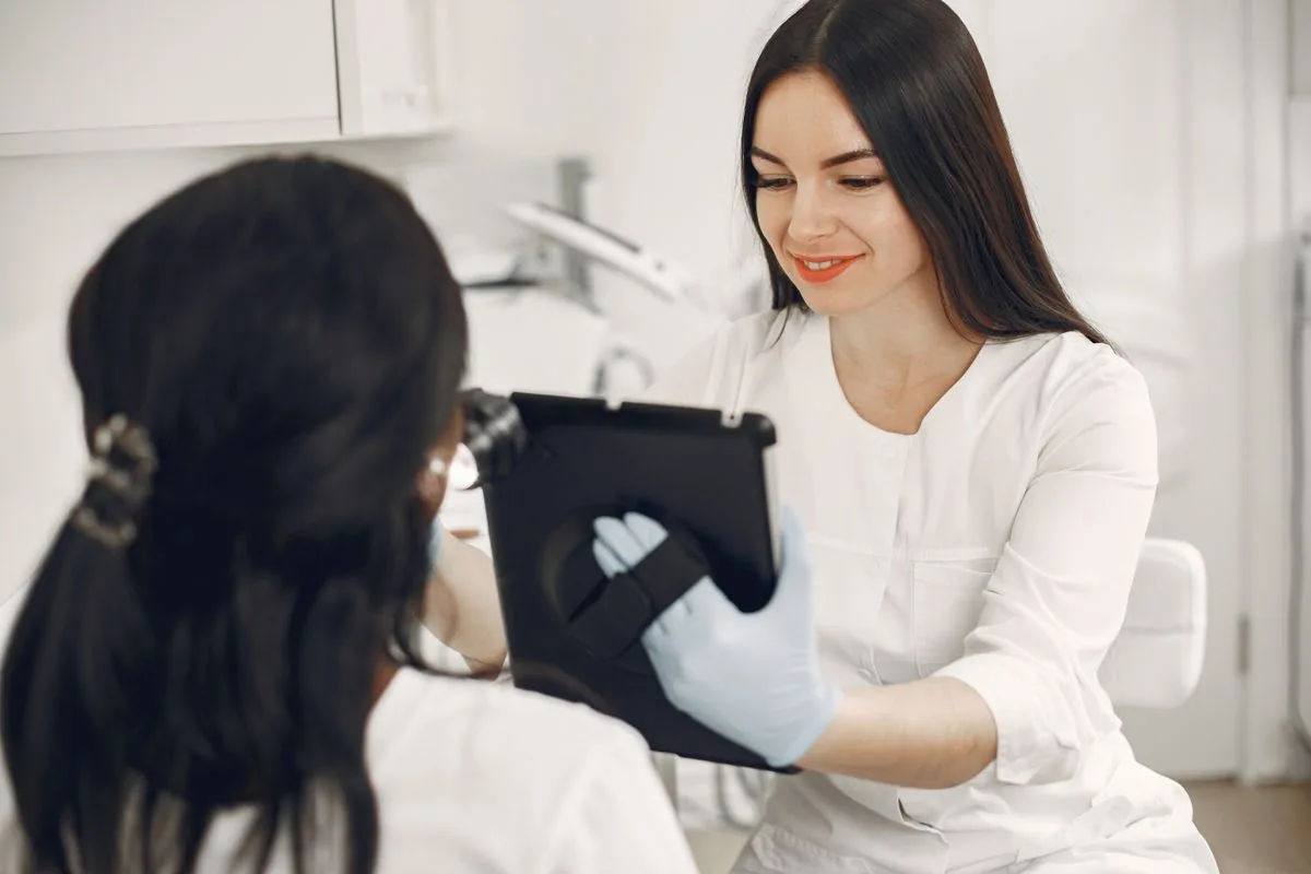 A female doctor consulting a client during a personalised skin consultation at Derma Skin and Hair Solutions
