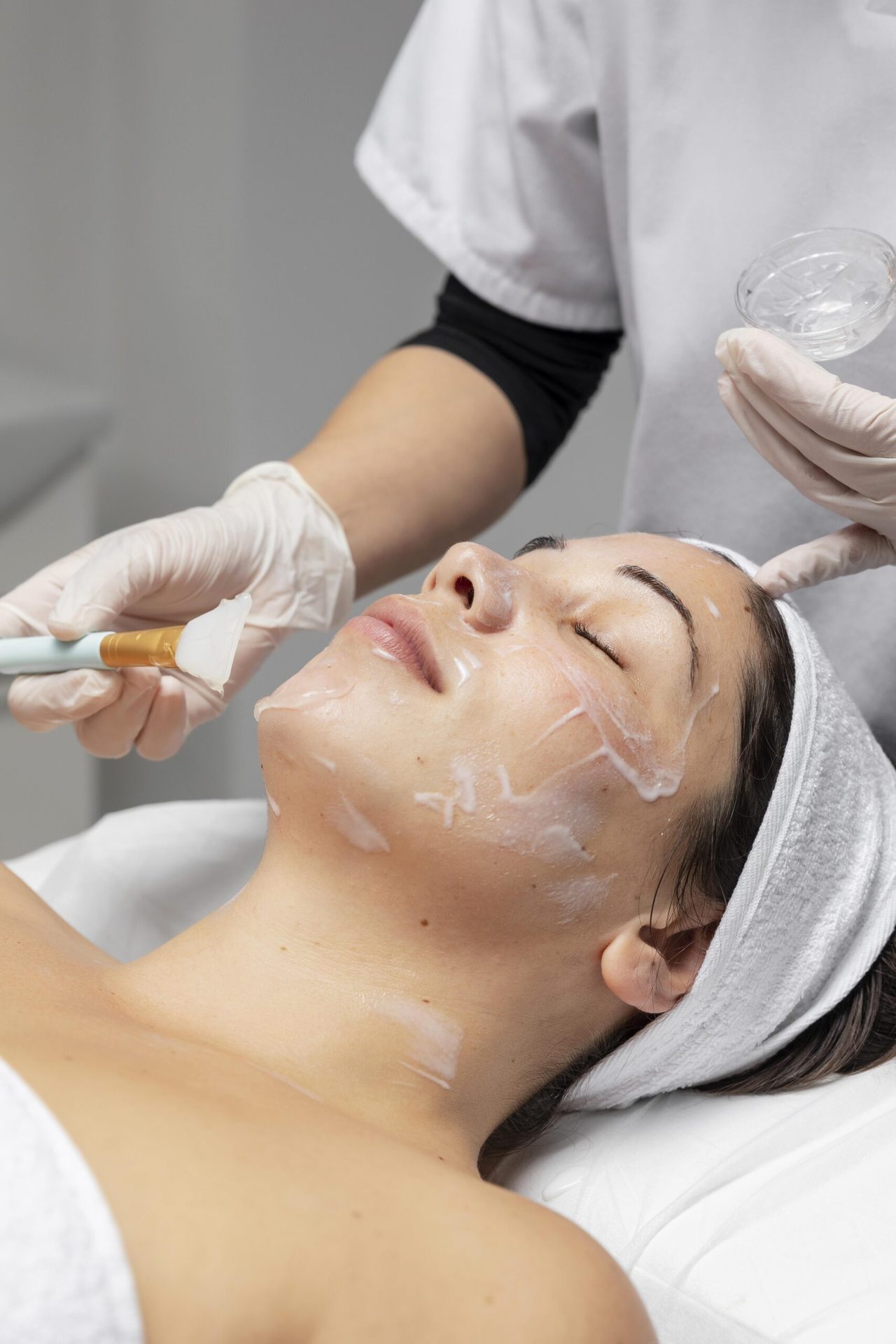 Client receiving a facial treatment at Derma Skin and Hair Solutions